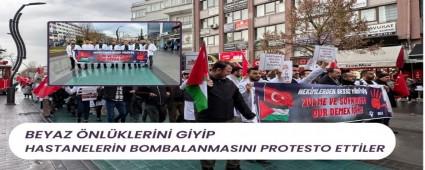 Beyaz nlklerini giyip hastanelerin bombalanmasn protesto ettiler
