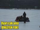 Buz tutan g�l�n �zerinde tehlikeli y�r�y��